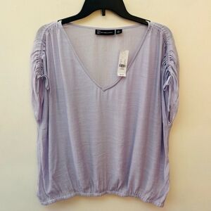 New York and Company Lavender V neck ruched cap sleeve elastic hem shirt size XL
